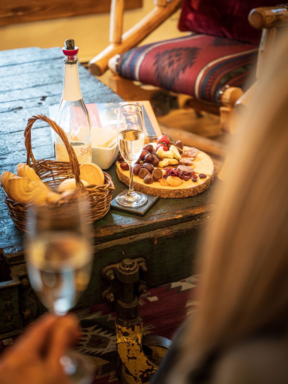 Shot of a woman with champagne at the Minturn Inn by Denver Hospitality, Travel & Tourism photographer Captain Colorado Photography.