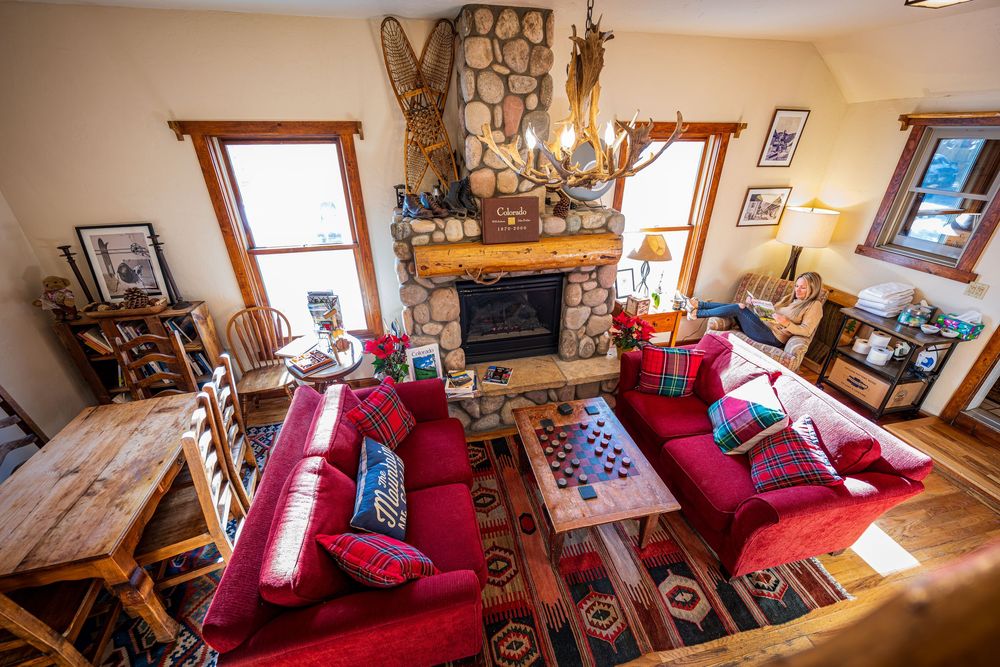 Shot of a woman reading at the Minturn Inn by Denver Hospitality, Travel & Tourism photographer Captain Colorado Photography.