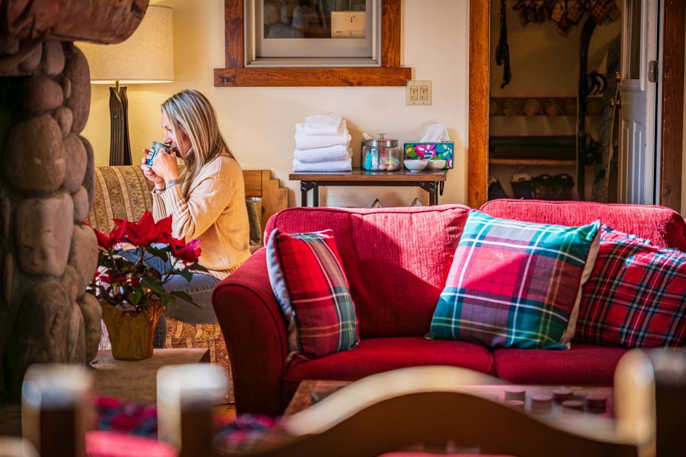 Shot of a woman sipping coffee at the Minturn Inn by Denver Hospitality, Travel & Tourism photographer Captain Colorado Photography.