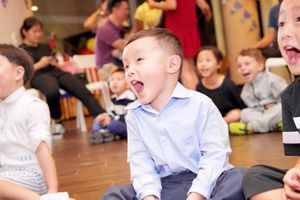 A joyful celebration scene showing excited children at a party.