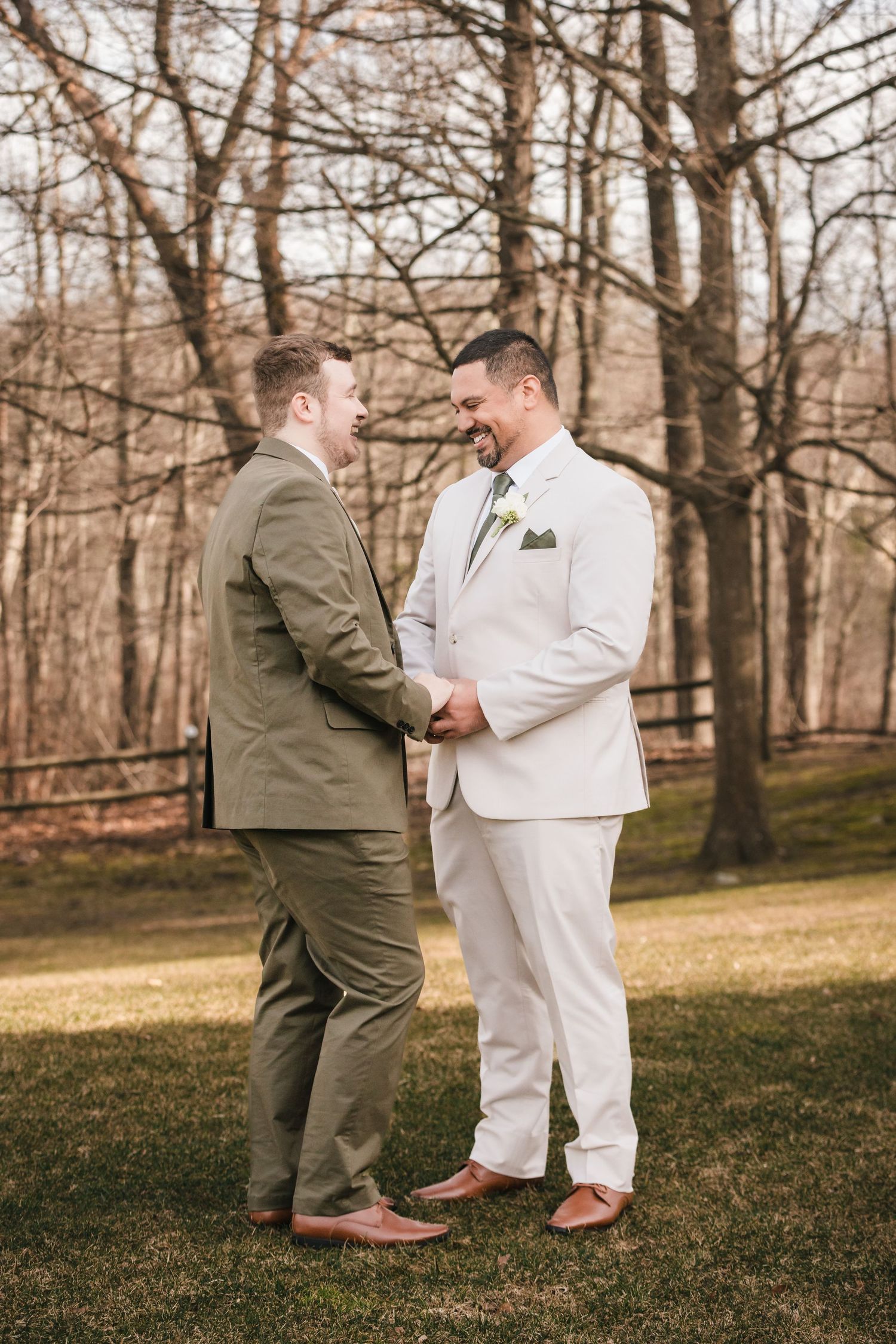 Grooms laughing together during first look portraits at Briar Barn Inn wedding Massachusetts