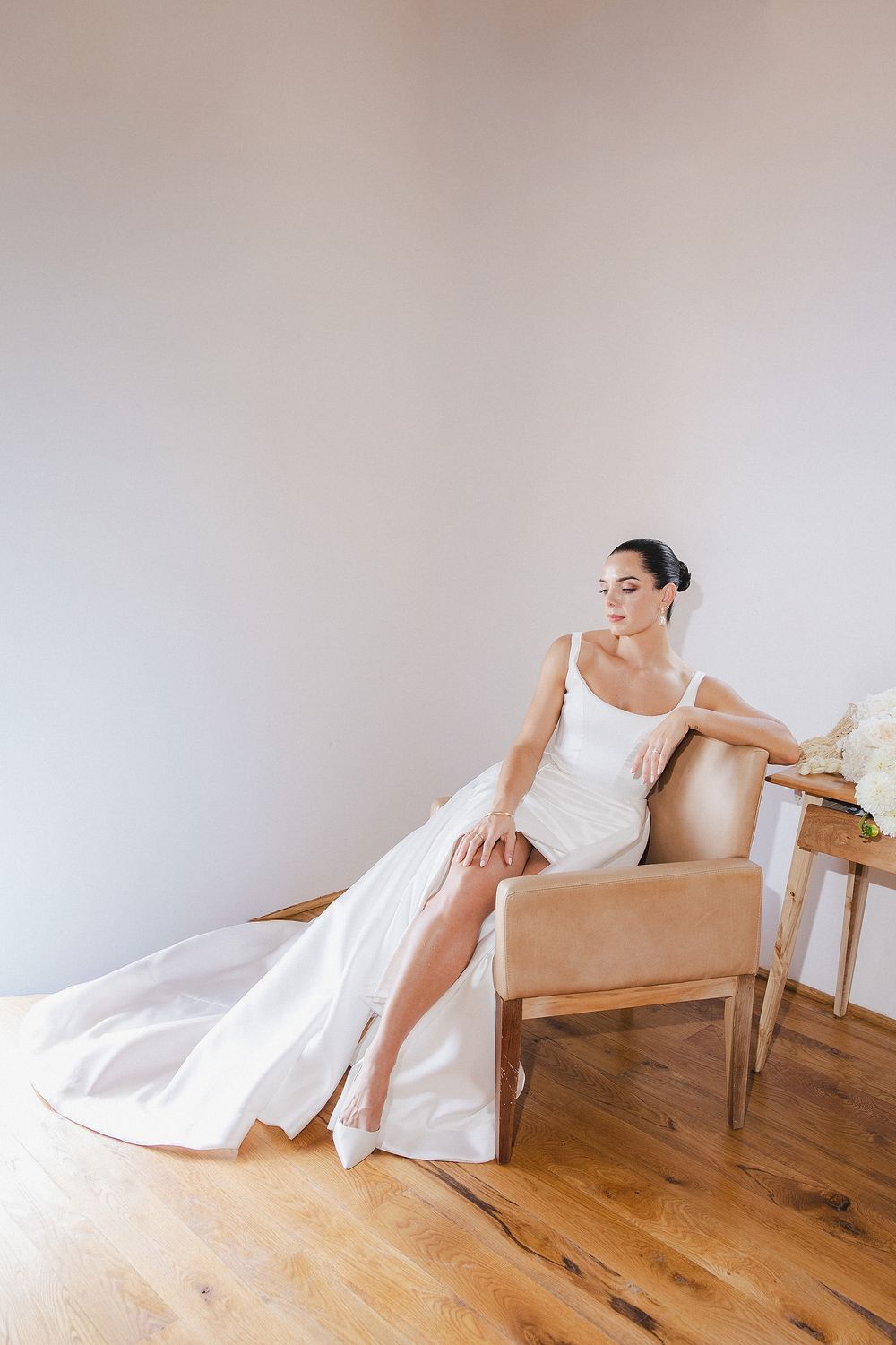 Bride Lizré posing in modern wedding gown with editorial-inspired composition