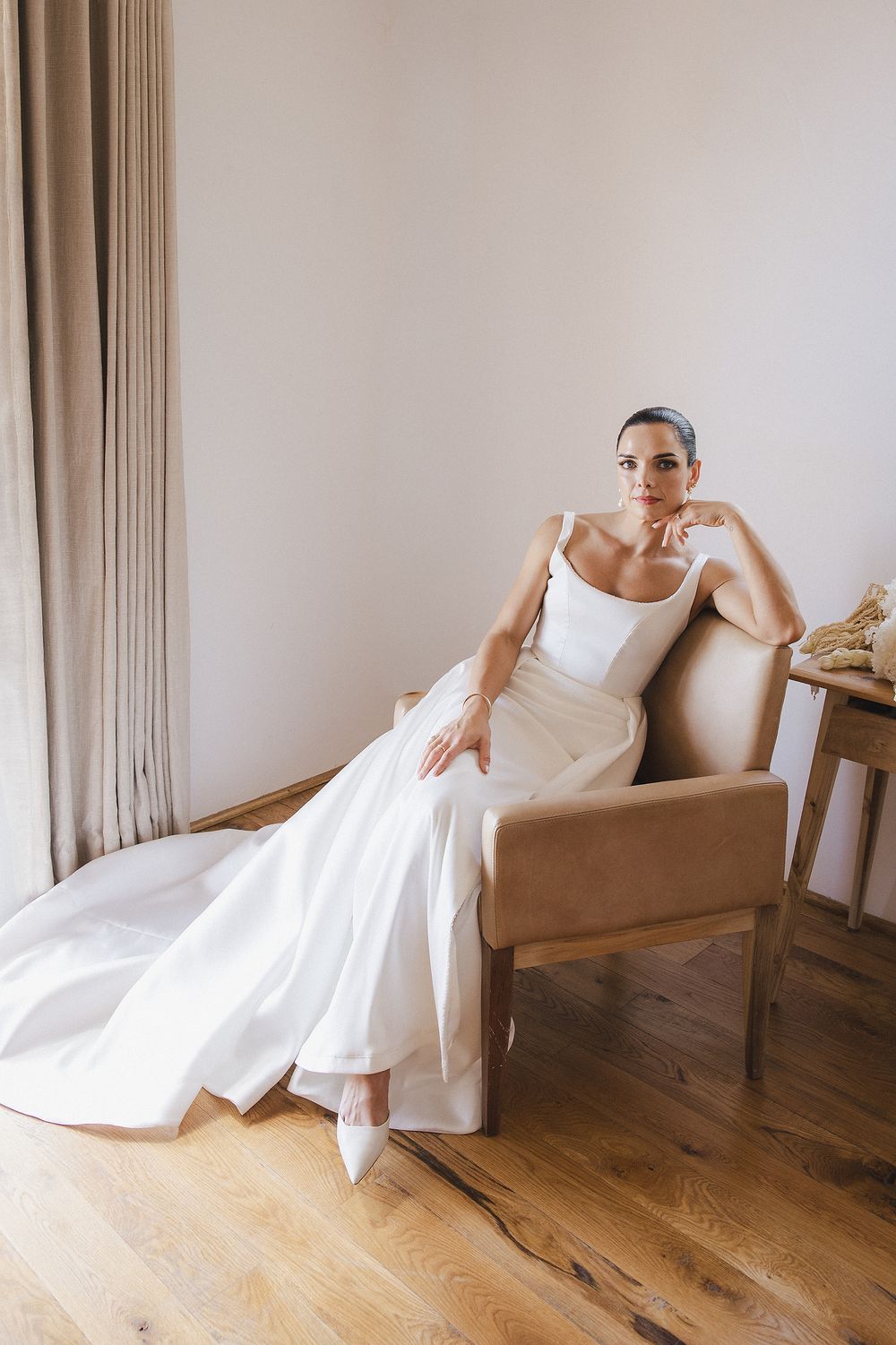 Bride Lizré posing in modern wedding gown with editorial-inspired composition