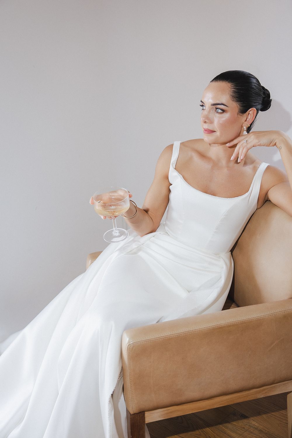 Bride Lizré posing in modern wedding gown with editorial-inspired composition