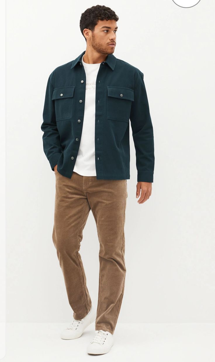 Man wearing teal button-up overshirt with chest pockets, white tee, tan corduroy pants, and white sneakers.