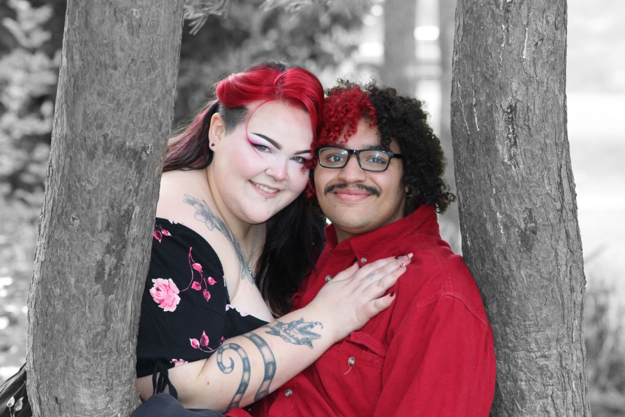 Creative black and white portrait of a couple with selective color for a modern artistic look