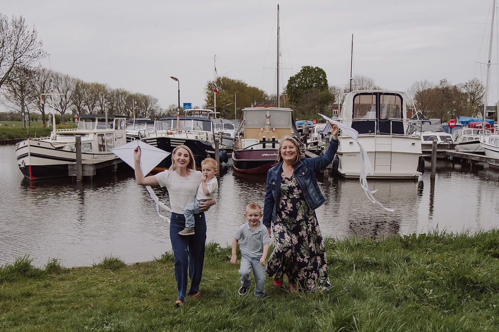 Grandmother playing with grandchildren during family photoshoot in Woerden, Netherlands