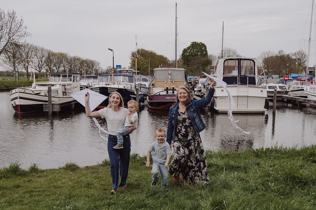 Grandmother playing with grandchildren during family photoshoot in Woerden, Netherlands