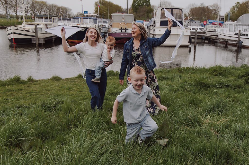 Three generations together during outdoor family session in Woerden