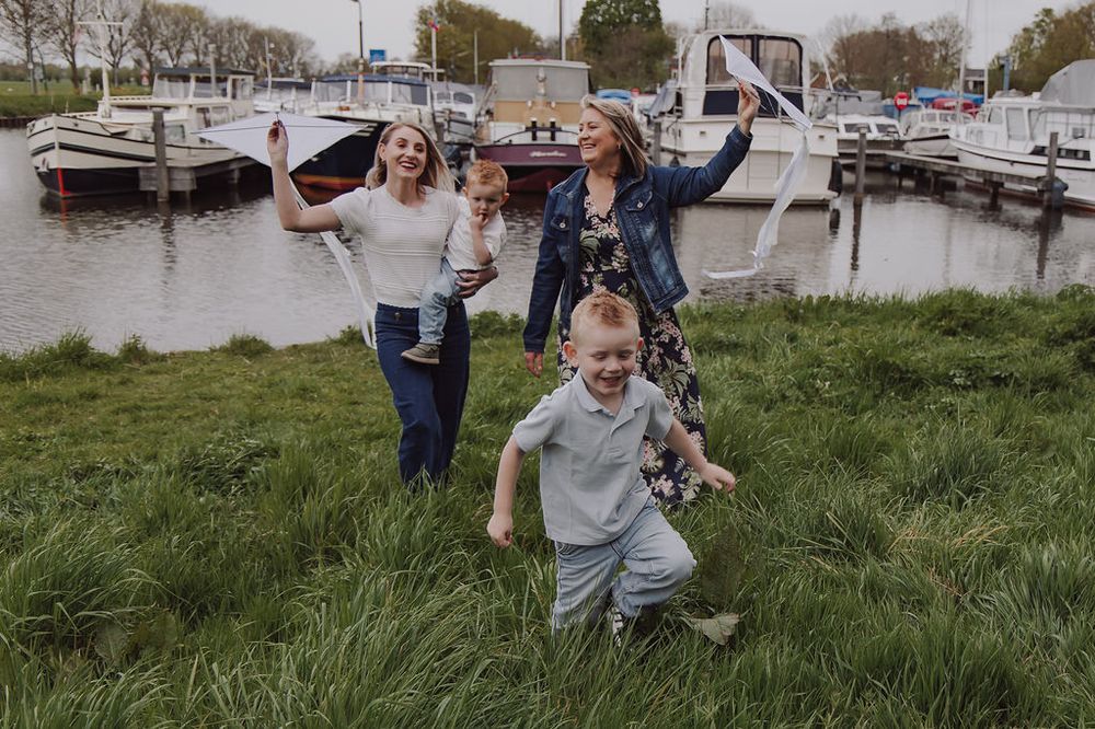 Three generations together during outdoor family session in Woerden