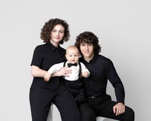 family studio portrait Sarasota white background parents with three kids and poodle clean modern timeless photography