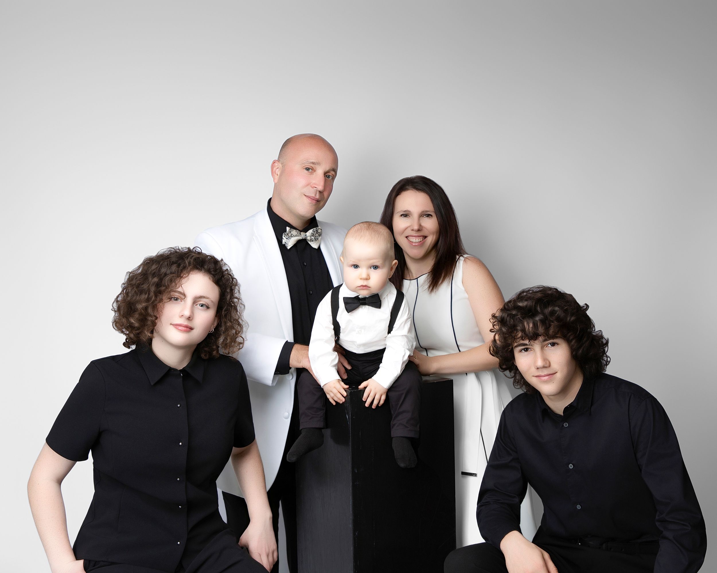 family studio portrait Sarasota white background parents with three kids and poodle clean modern timeless photography