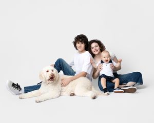 family studio portrait Sarasota white background parents with three kids and poodle clean modern timeless photography
