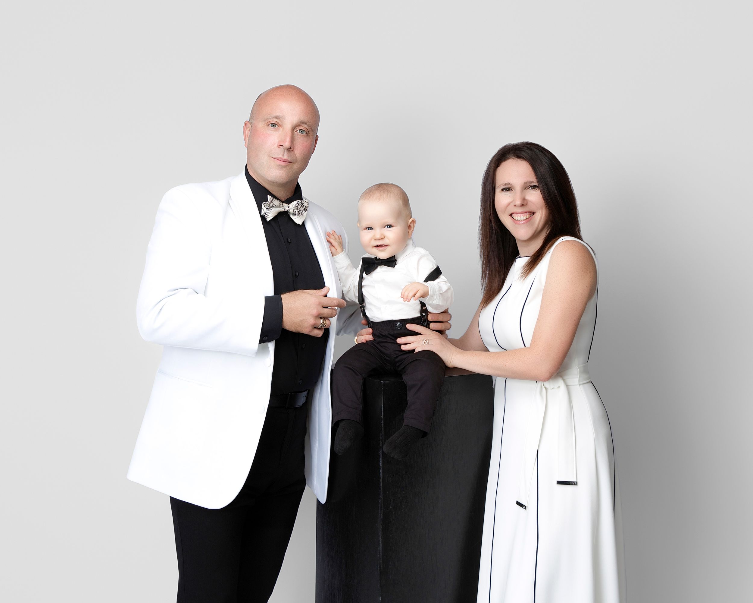 family studio portrait Sarasota white background parents with three kids and poodle clean modern timeless photography