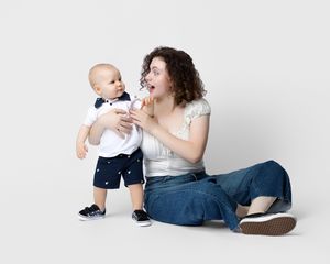 family studio portrait Sarasota white background parents with three kids and poodle clean modern timeless photography