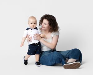 family studio portrait Sarasota white background parents with three kids and poodle clean modern timeless photography