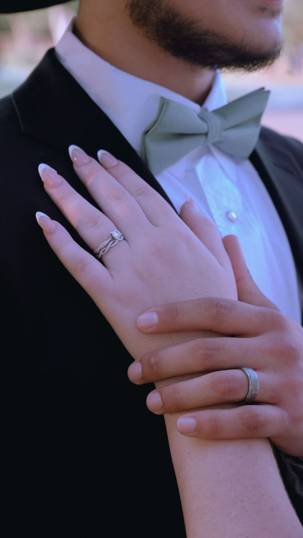 Close-up series of wedding rings and clasped hands in formal attire showing various angles of a couple's intertwined fingers.