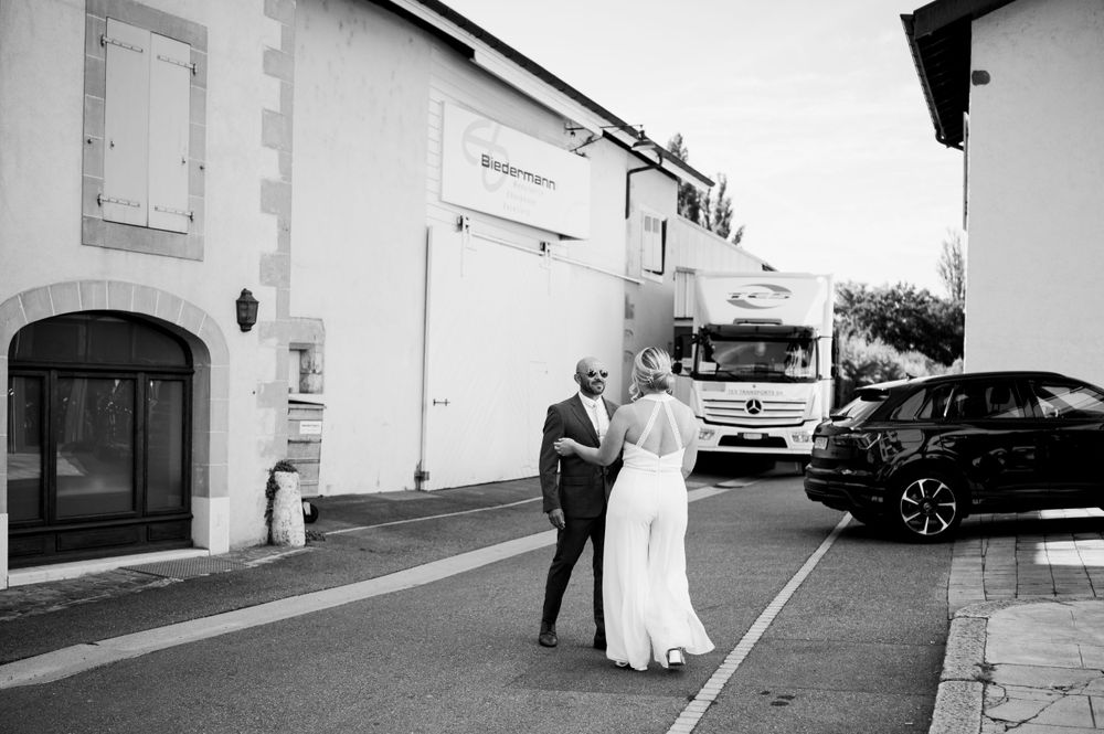 Joyful Bride and groom meeting at their first look in a street in Geneva, Switzerland before their civil wedding.