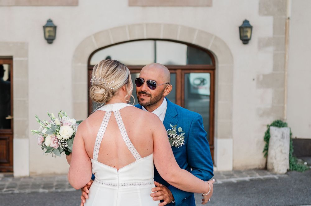 Joyful Bride and groom meeting at their first look in a street in Geneva, Switzerland before their civil wedding.