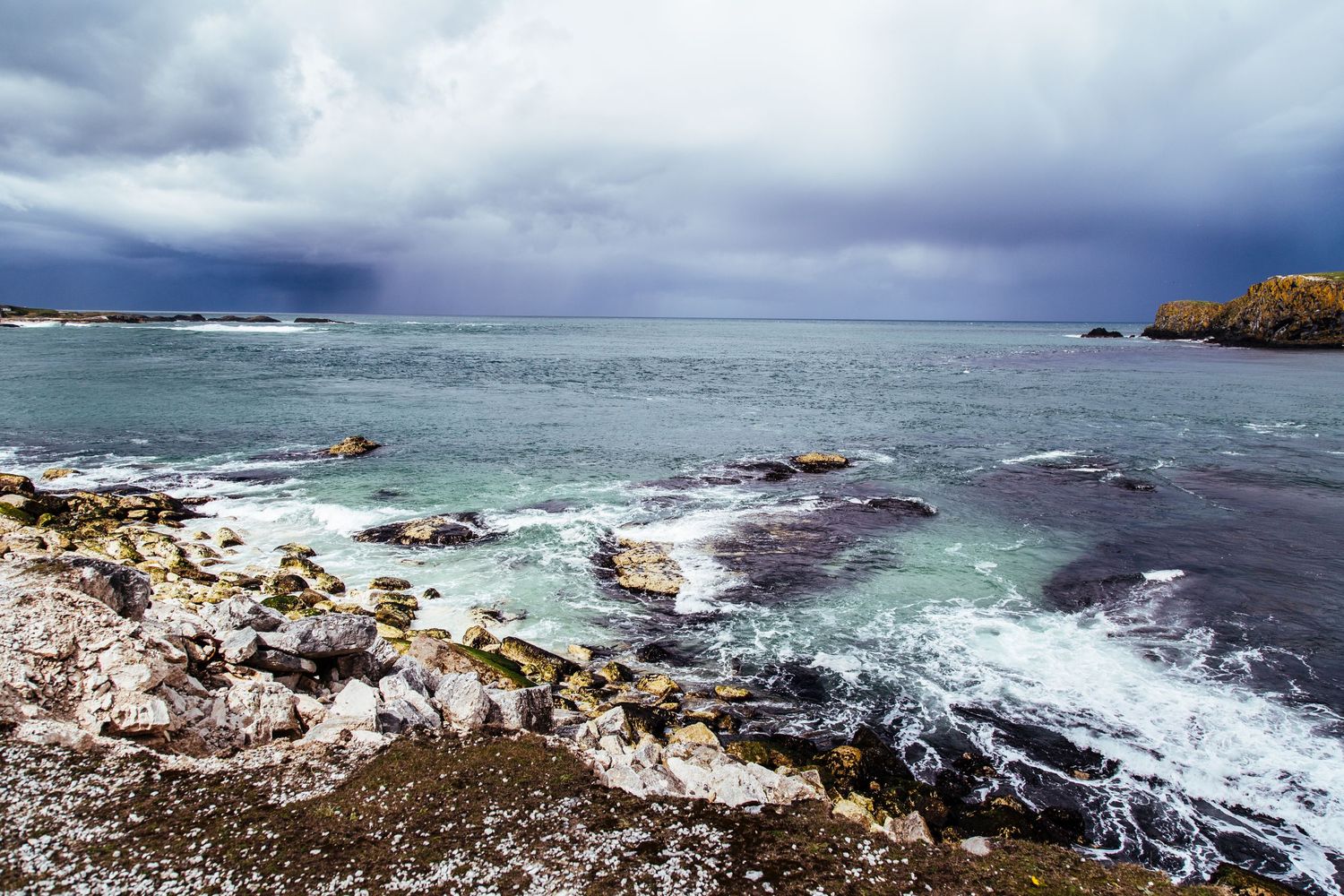 Landscape photo of the north coast Northern Ireland, Waves hitting the shoreline.