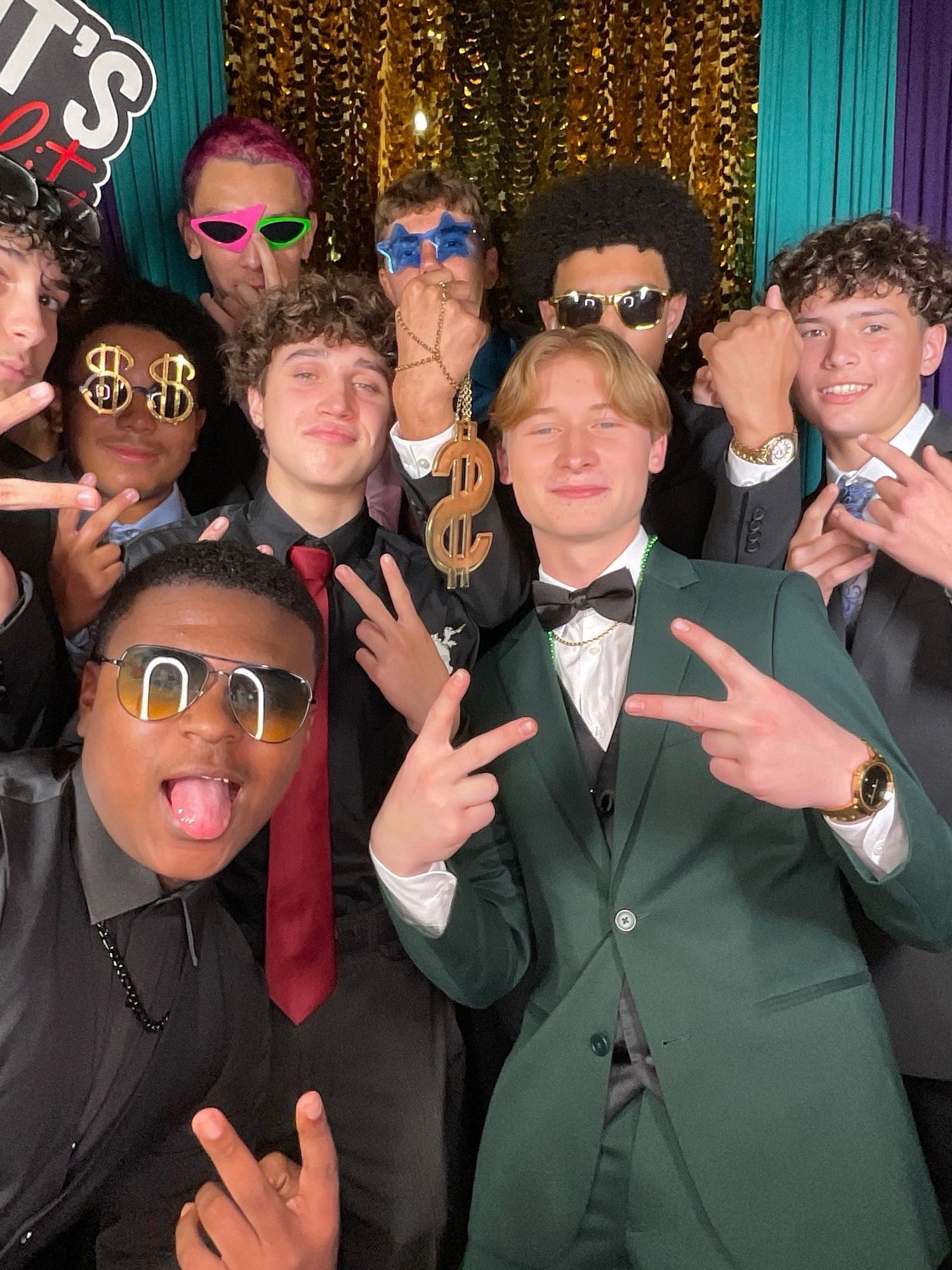 Photo booth strip with silver sequin backdrop and homecoming date for September 28, 2024.