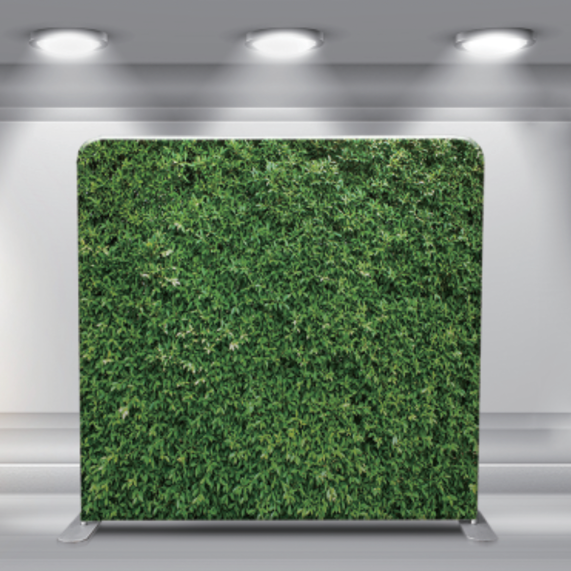 Green hedge wall backdrop with dense leafy foliage texture.