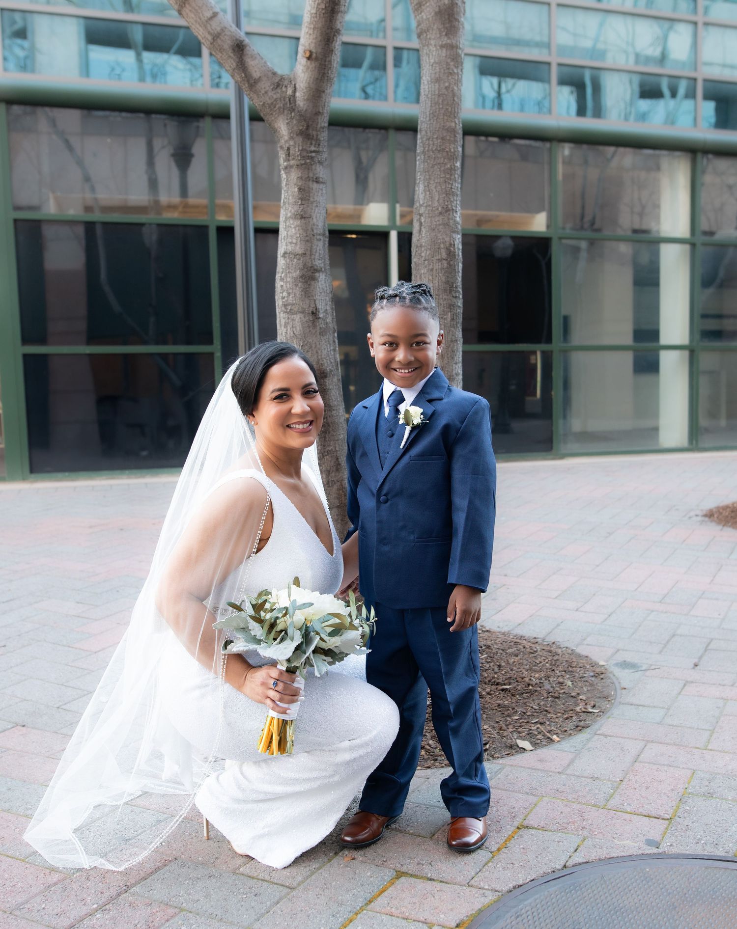 Bride and groom on their wedding day and family