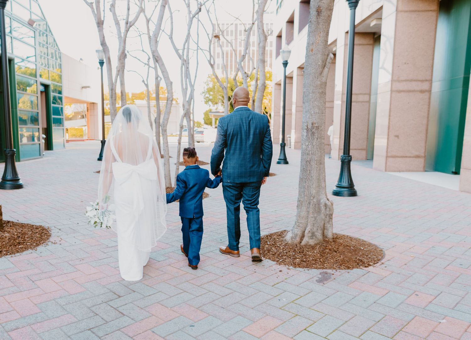 Bride and groom on their wedding day and family
