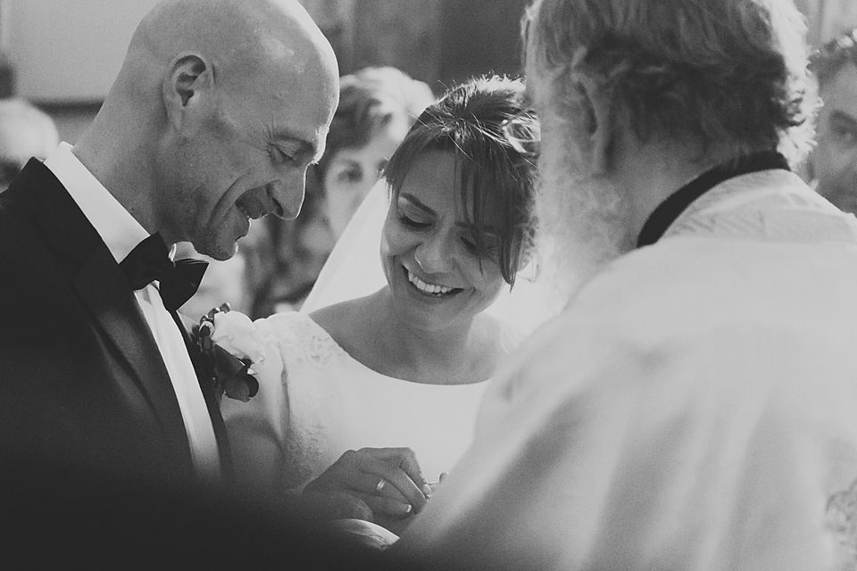Emotional black and white wedding moment showing genuine expressions of happiness.