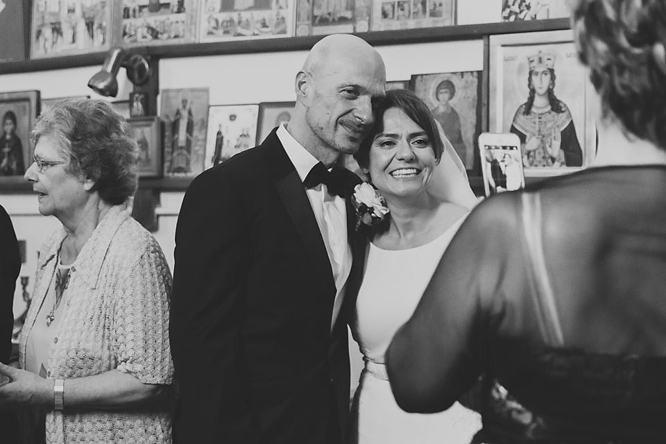 Wedding guests sharing laughter and conversation during the reception celebration.