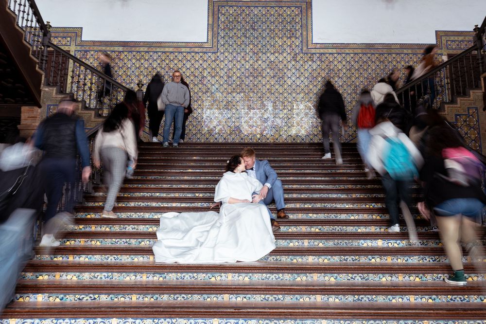 A time-lapse sequence shows people ascending and descending ornate stone steps at different times of day.