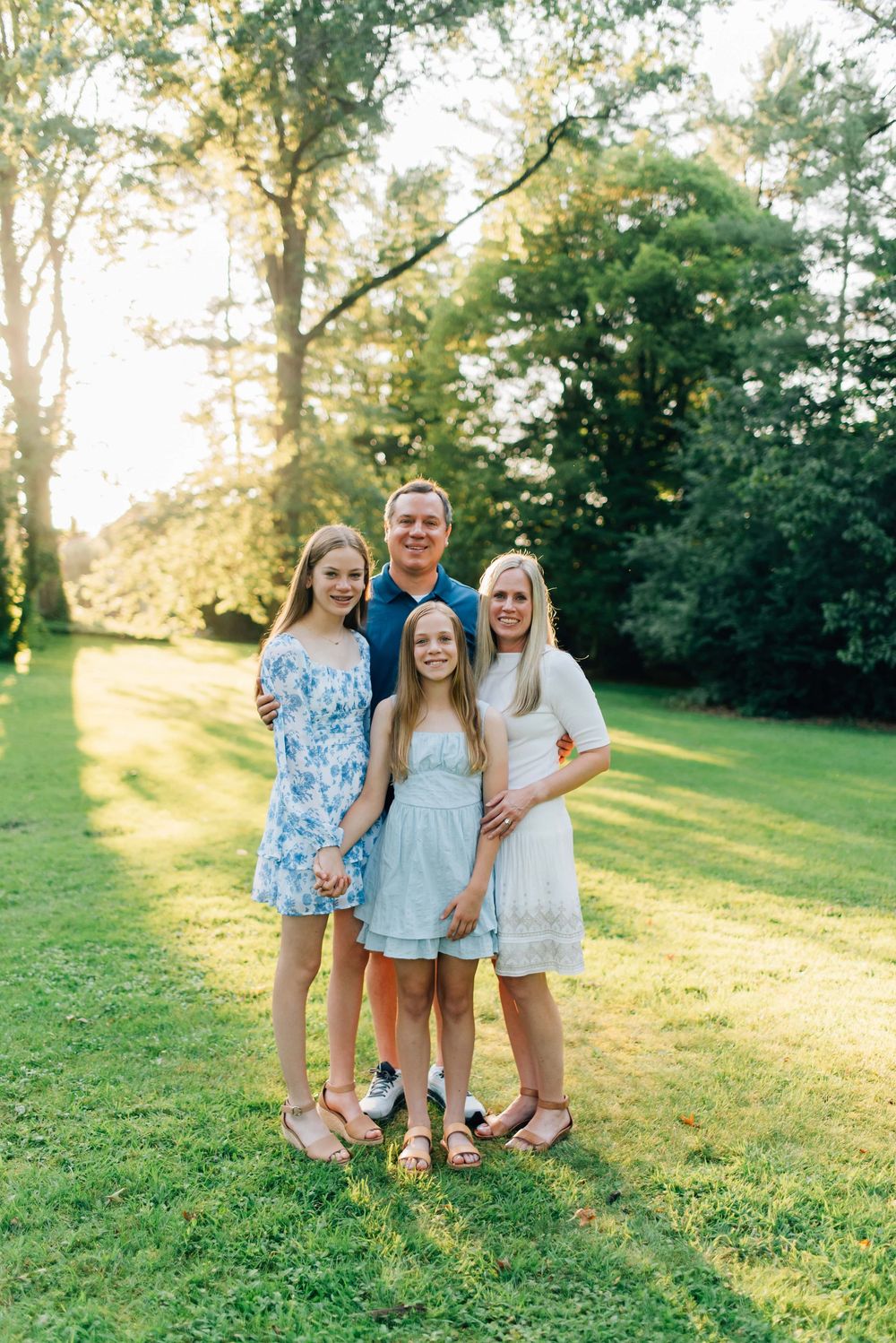 Family smiling at golden hour at Succop Nature Park in Butler, PA