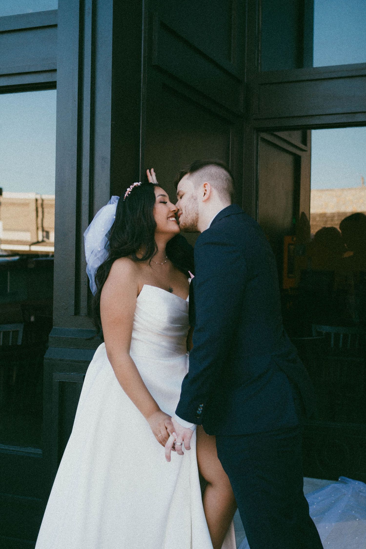 A series of romantic wedding photos showing a couple in white dress and dark suit sharing intimate moments.