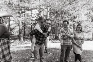 Black and white candid photos showing joyful moments between family members in a natural setting.