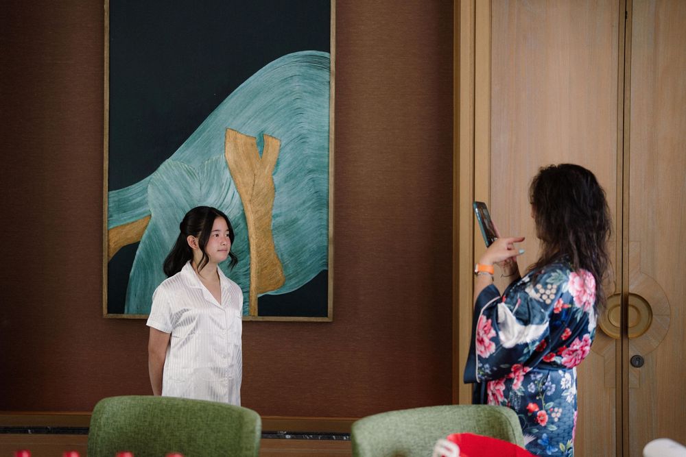 A series of photos showing someone opening a door and entering a room with teal-colored walls.
