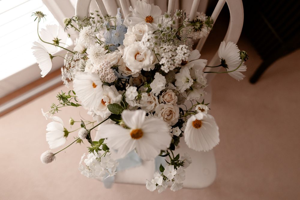 Elegant white floral arrangements with delicate petals and greenery.