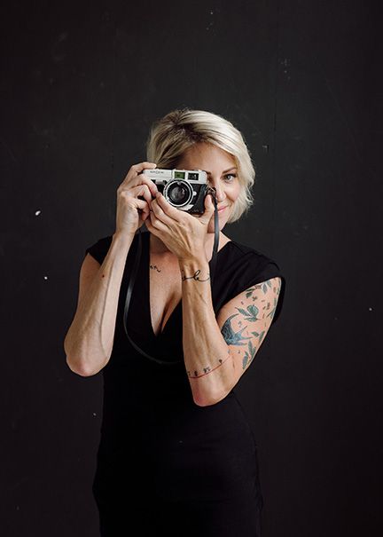 Artistic sequence showing photographer with vintage camera against black backdrop.