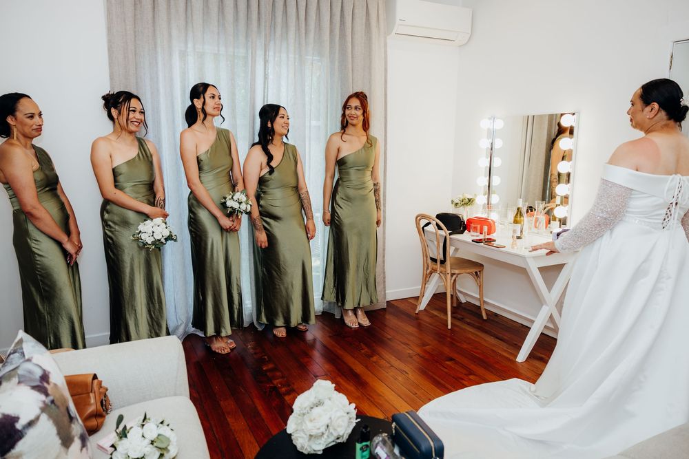A sequence of wedding preparation photos showing bridesmaids in olive green dresses and a bride in white getting ready.