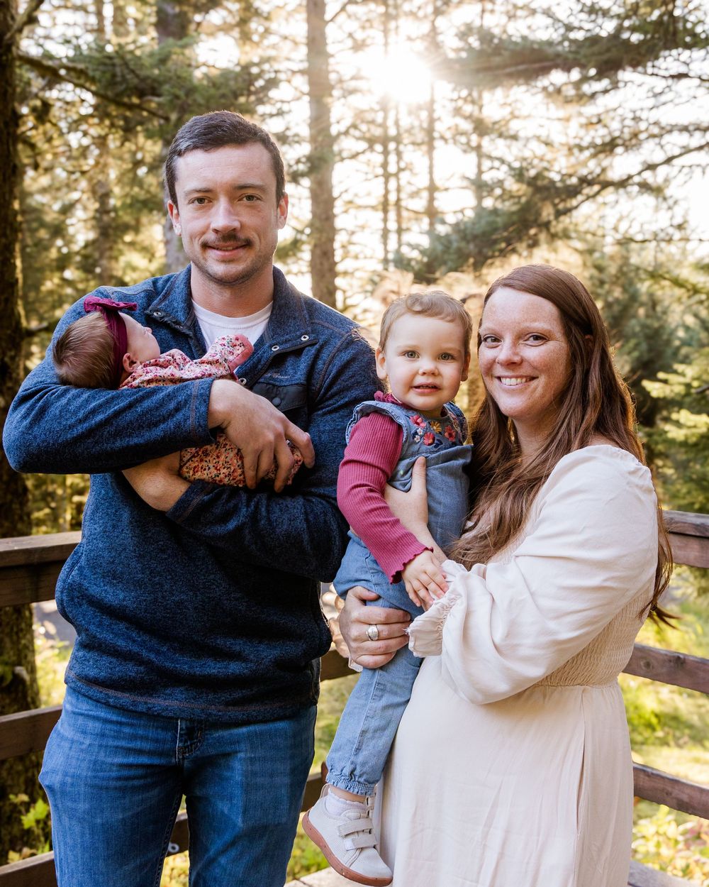 A series of candid family photos showing warm embraces and smiles in a sunlit forest setting.