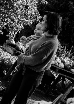 Black and white sequence of cozy fall moments outdoors with pumpkins.