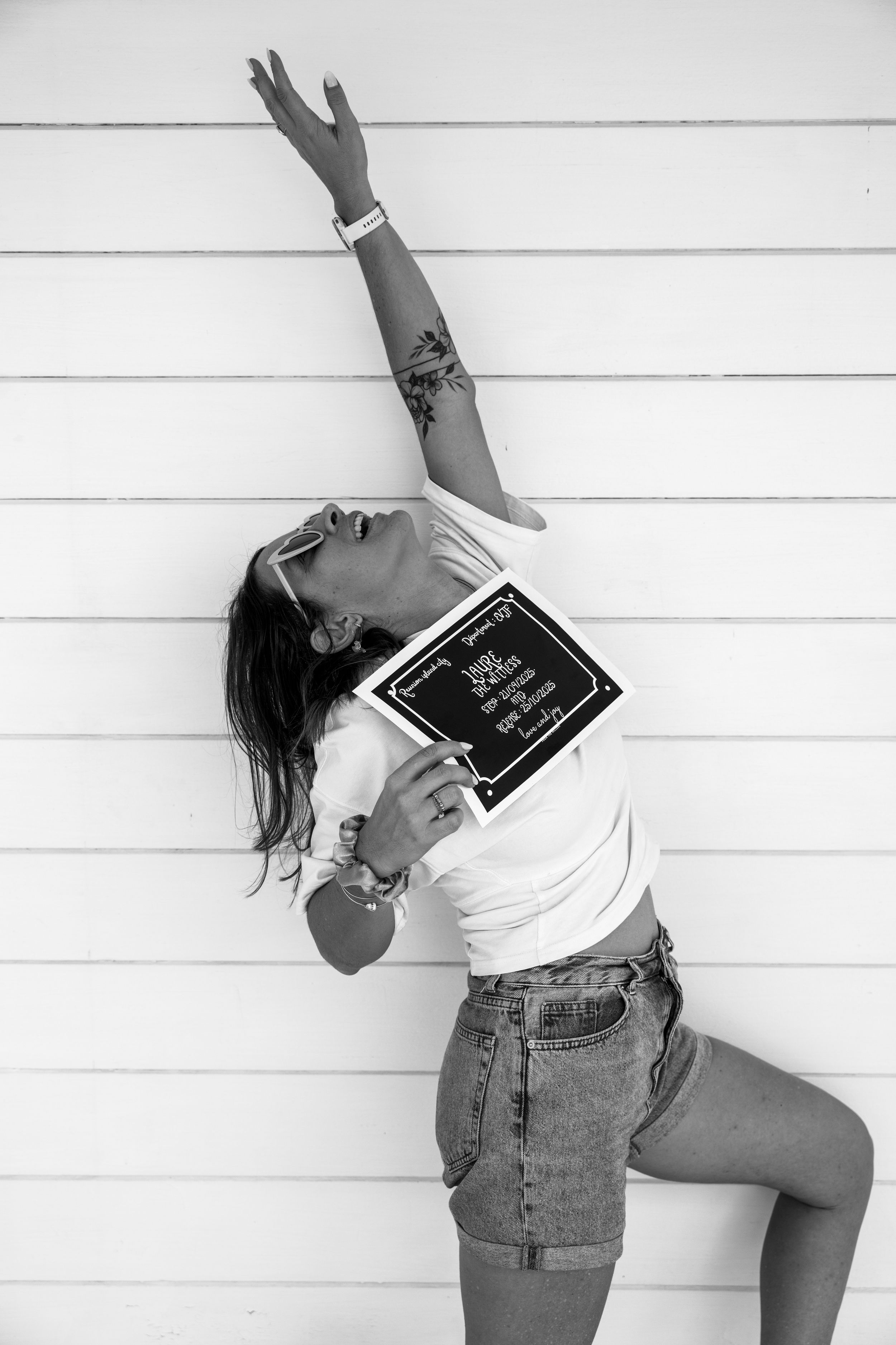 Dynamic black and white poses showing person in casual wear against white wall.