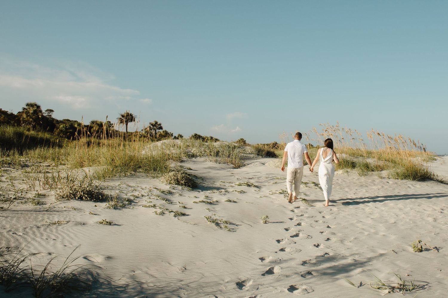 couples holding hands walking on beach, elopement, Cincinnati, northern Kentucky, travel photographer, beach elopement