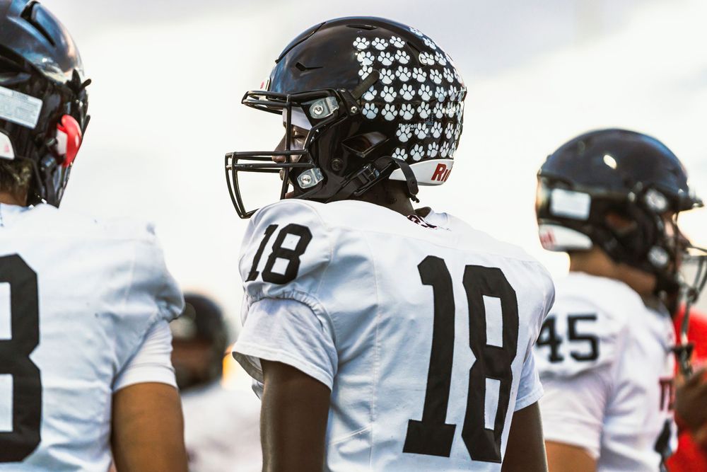 Football player looking off left frame