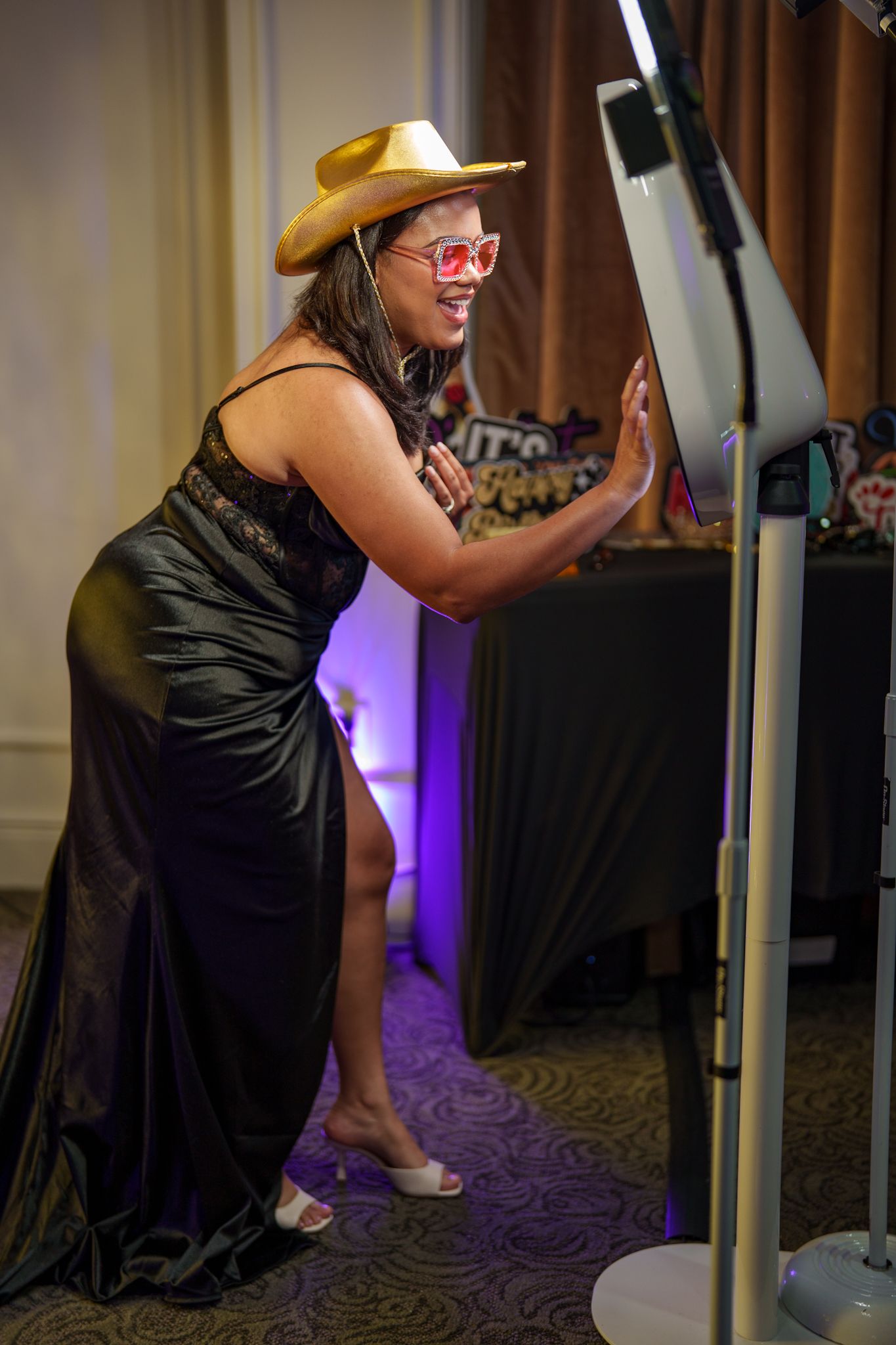 Interactive photo booth setup with illuminated ring light display.
