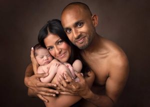 A series of warm-toned professional portraits showing a family posing together with their newborn baby in a studio setting.