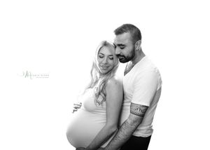 A black and white maternity photo collage showing three intimate poses of an expecting couple.