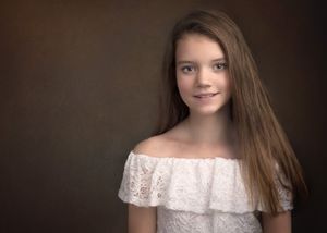 Portrait series showing a progression of subtle expressions and poses against a dark background.