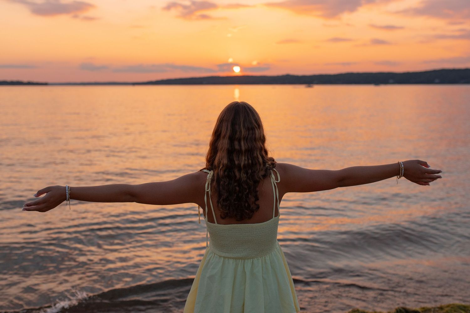 A senior girl taking in the beautiful sunset!