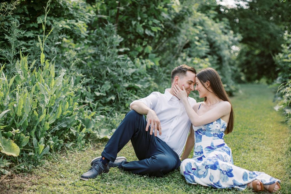 Romantic couple's photo session in a lush garden setting.