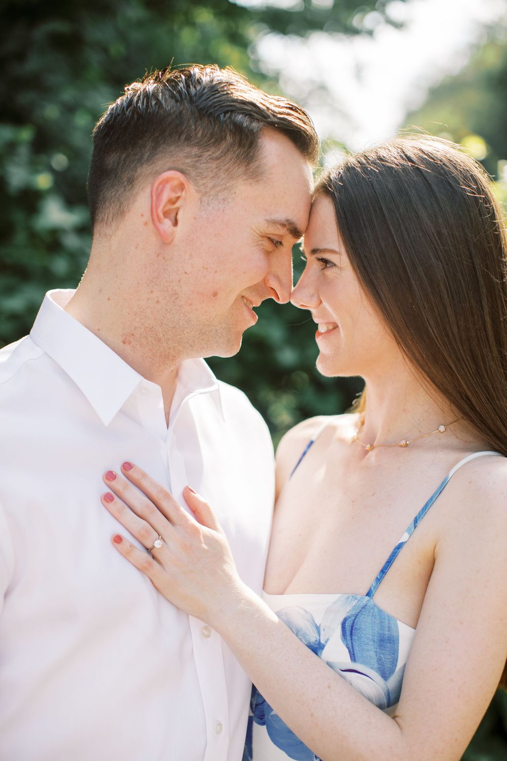 Romantic couple sharing an intimate moment during an outdoor photoshoot.